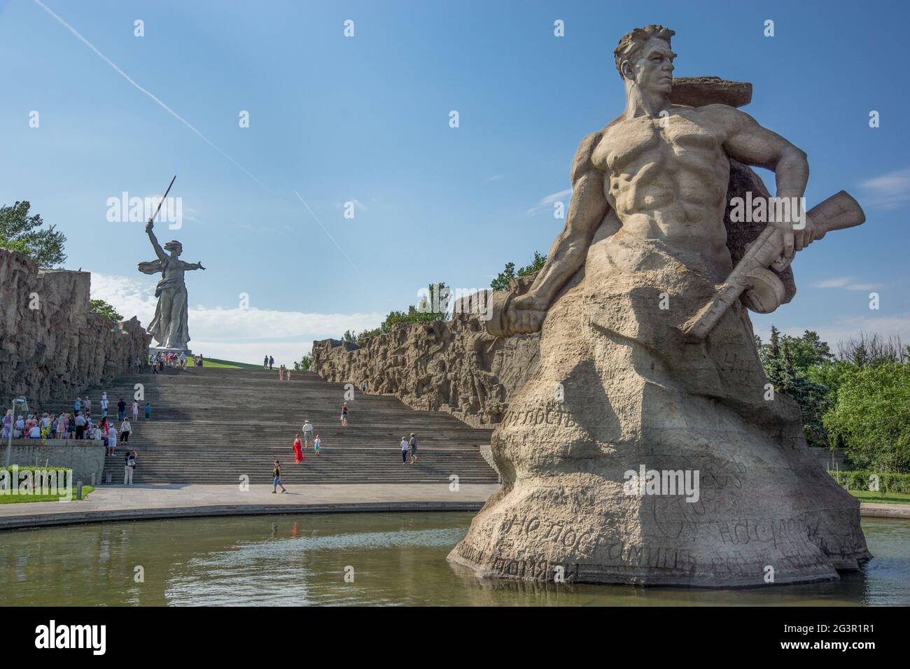 Volgograd/Russia-18.06.2016:The statue of The Motherland Calls on Mamayev Kurgan and soldier statue with gun Stock Photo