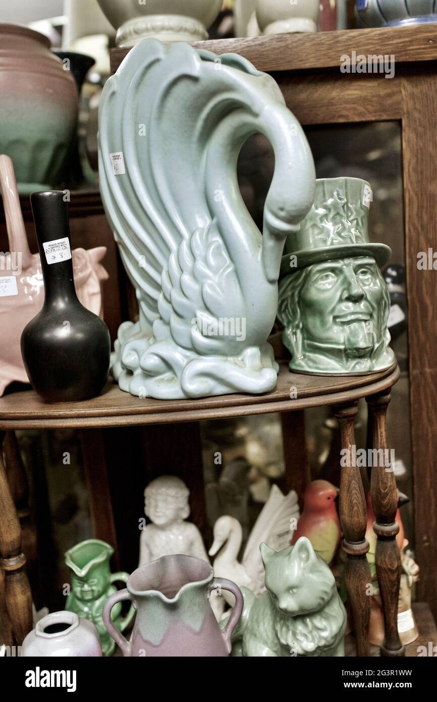 Swan vase with other ceramic collectables in Antique Store in Chester, New  Jersey, USA Stock Photo - Alamy