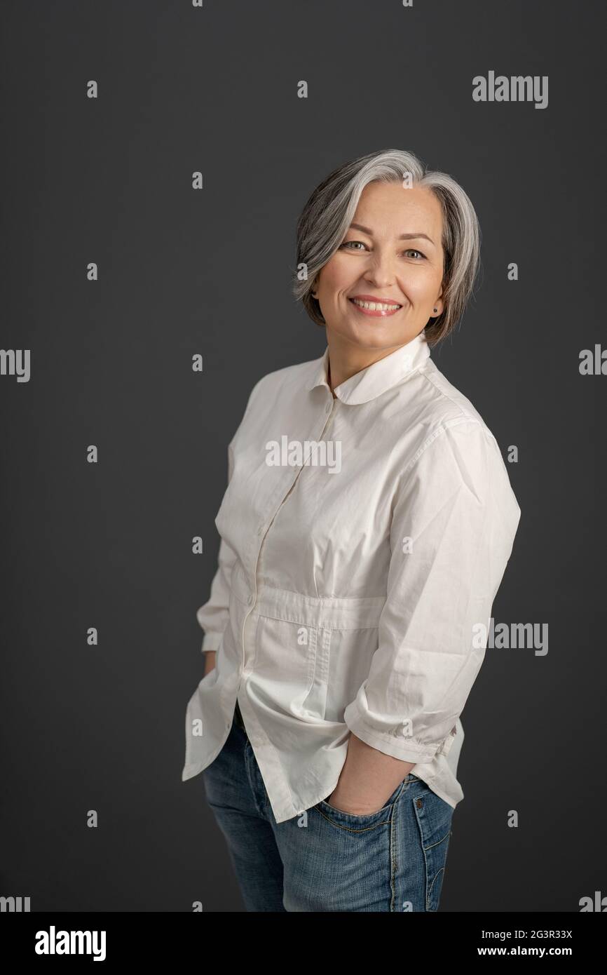 Beautiful mature woman posing in hi-res stock photography and images ...