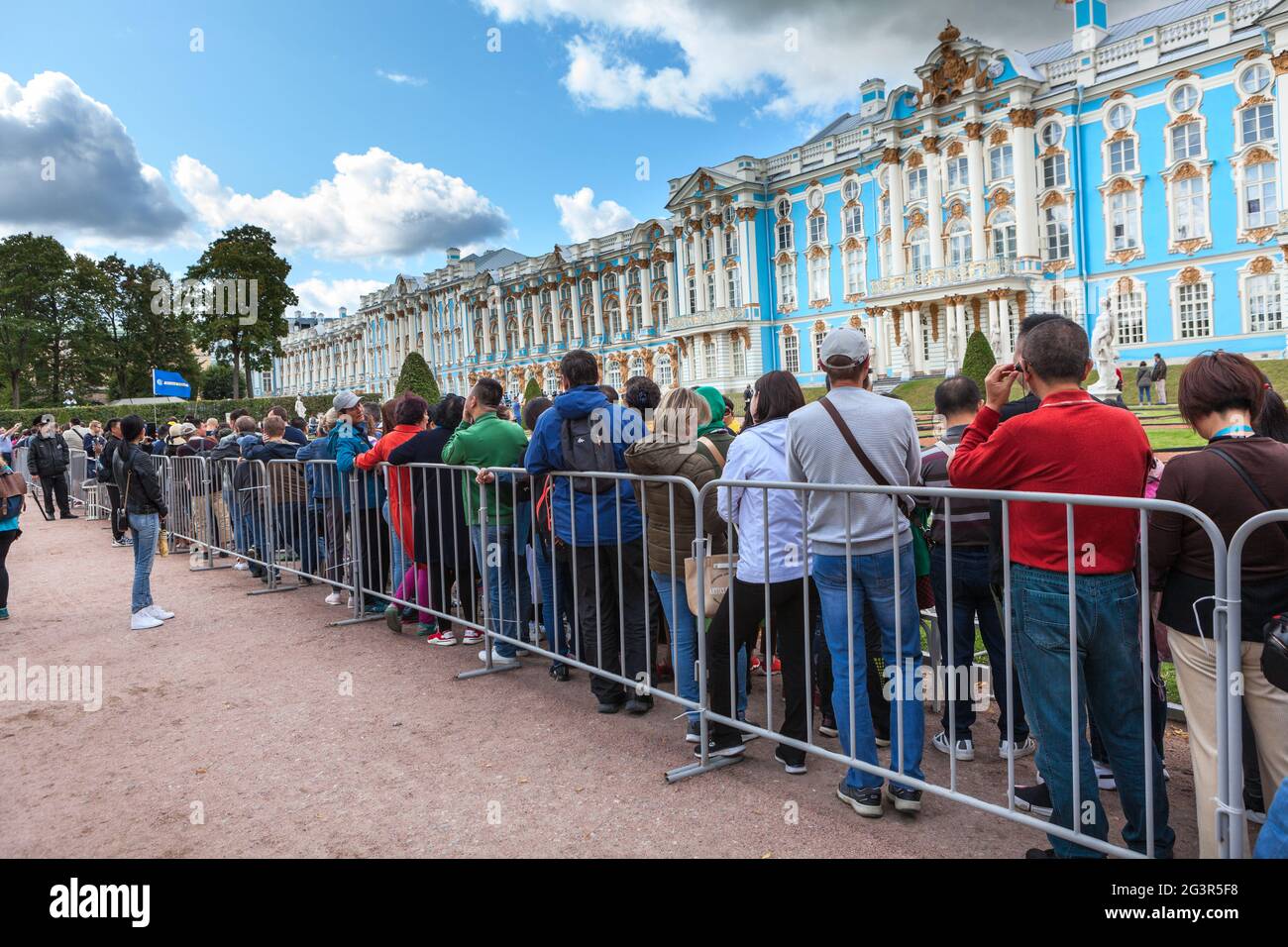 Pushkin town, St. Petersburg, Russia-circa Aug, 2019: Visitors stand in long queue to visit the Amber Room of the Great Catherine Palace. Museum-reser Stock Photo