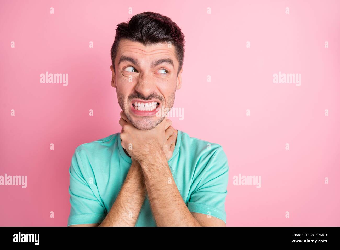 Photo of young unhappy aggressive angry furious man look copyspace