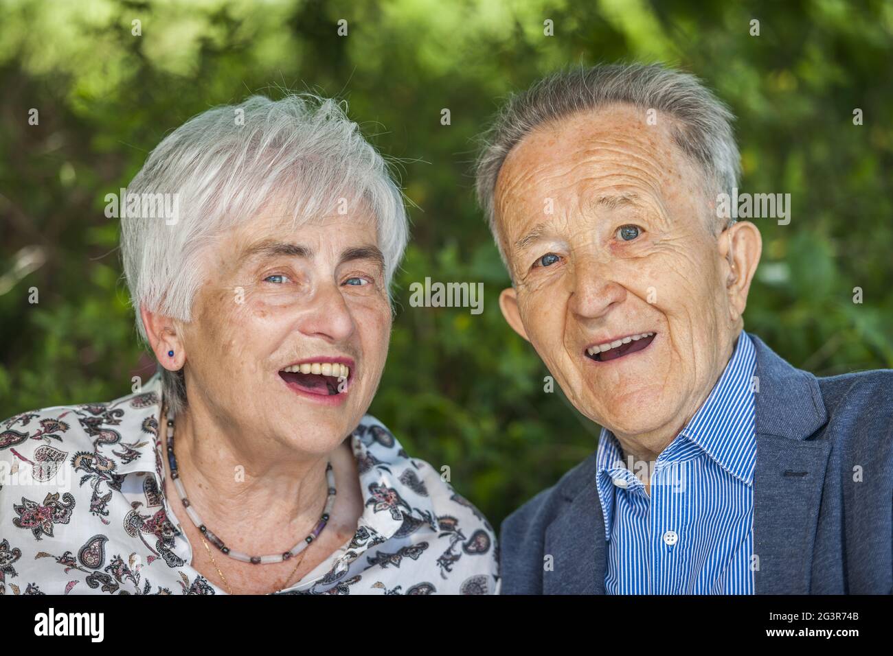 Nice old couple with open laughter Stock Photo