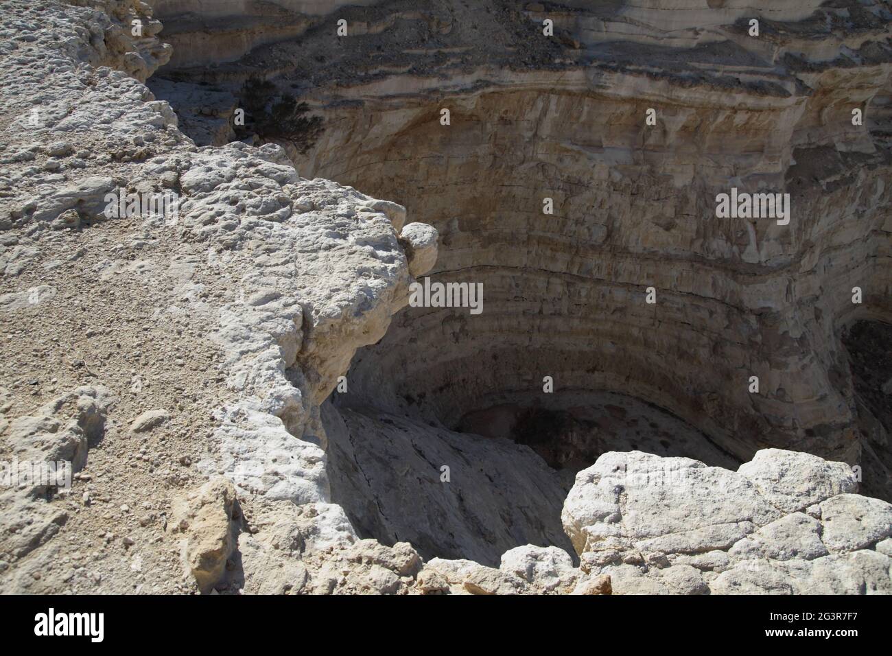 Frightening deep chasm, abyss at the bottom of a dry riverbed under the