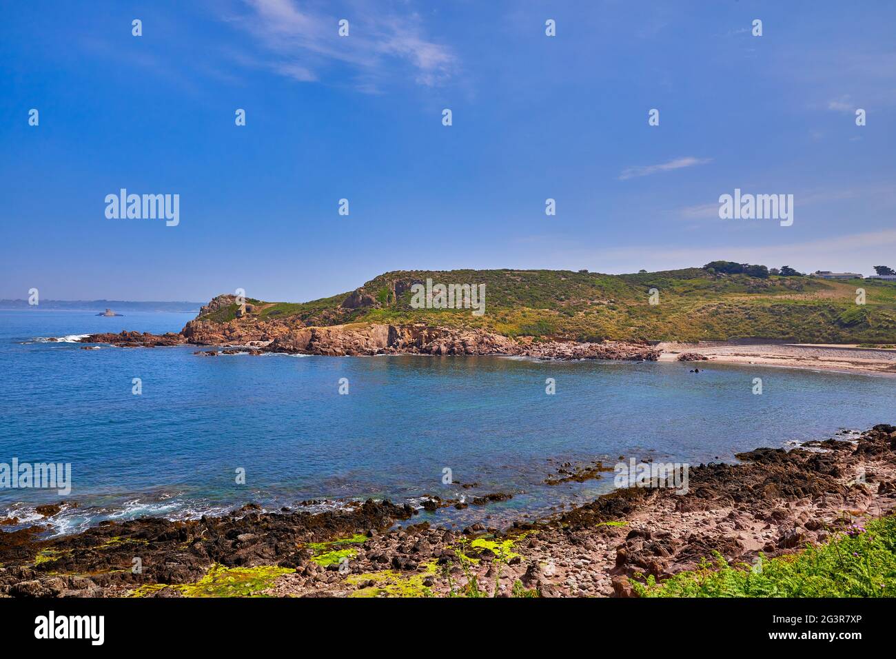 Image of Petit Port, Jersey CI, with St Ouens Bay and Roco Tower in the back ground. Stock Photo