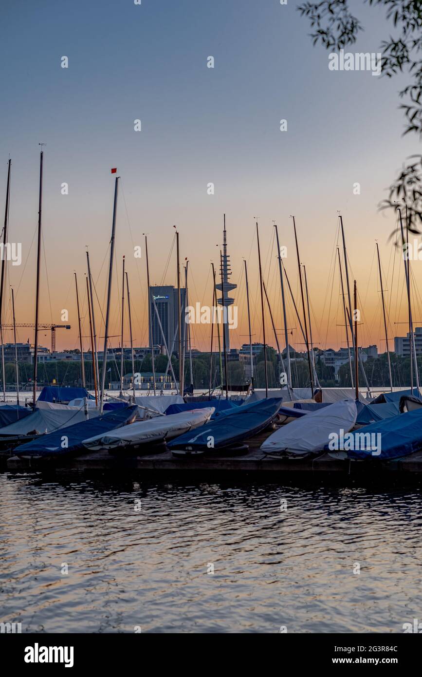 Hamburg Außenalster with sailing boats and the Radisson Blu Hotel and the Heinrich Hertz tower Stock Photo