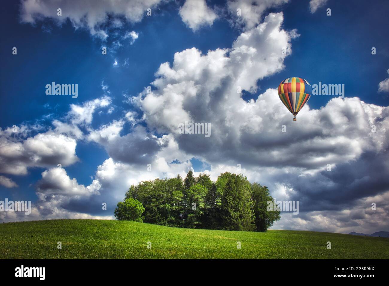 DE - BAVARIA: Hot Air Ballon travelling above typical Bavarian setting Stock Photo