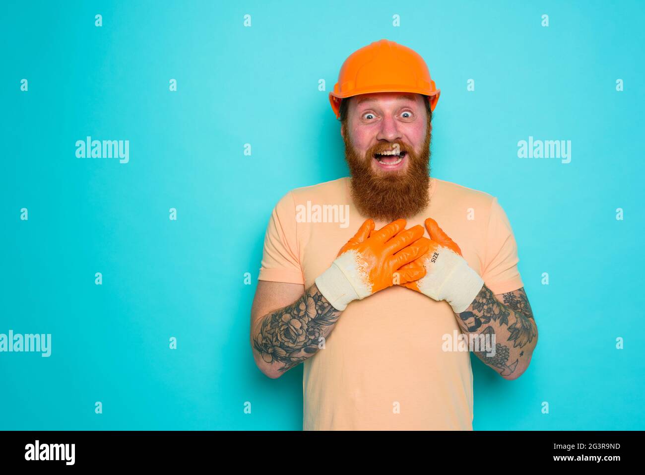 Worker with yellow hat is happy about his work Stock Photo Alamy