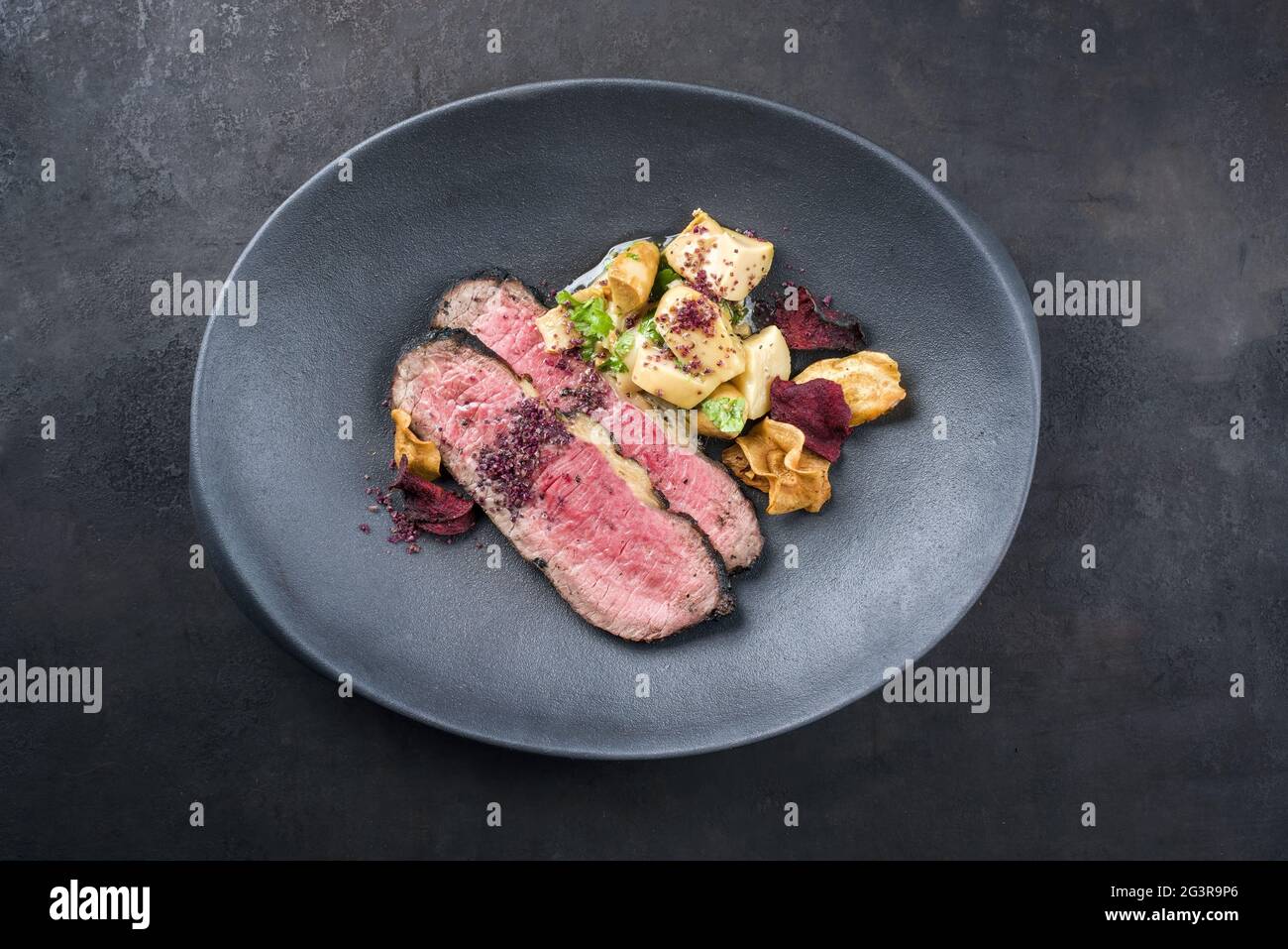 Modern style Commonwealth Sunday roast with sliced cold cuts roast beef