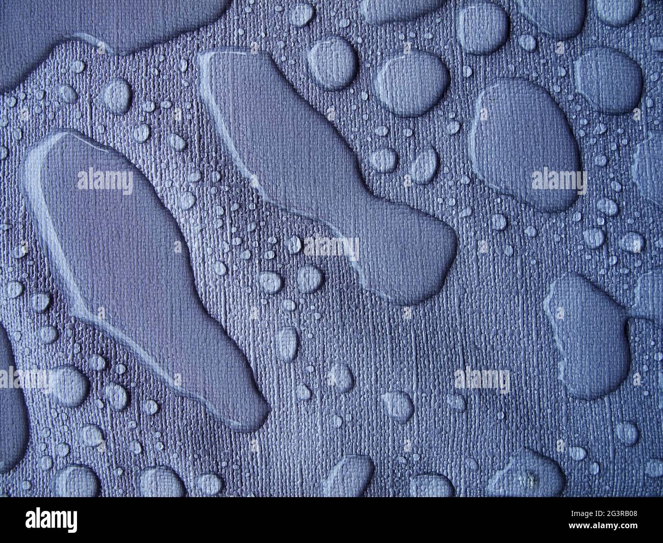 Raindrops on a blue tablecloth blue Stock Photo