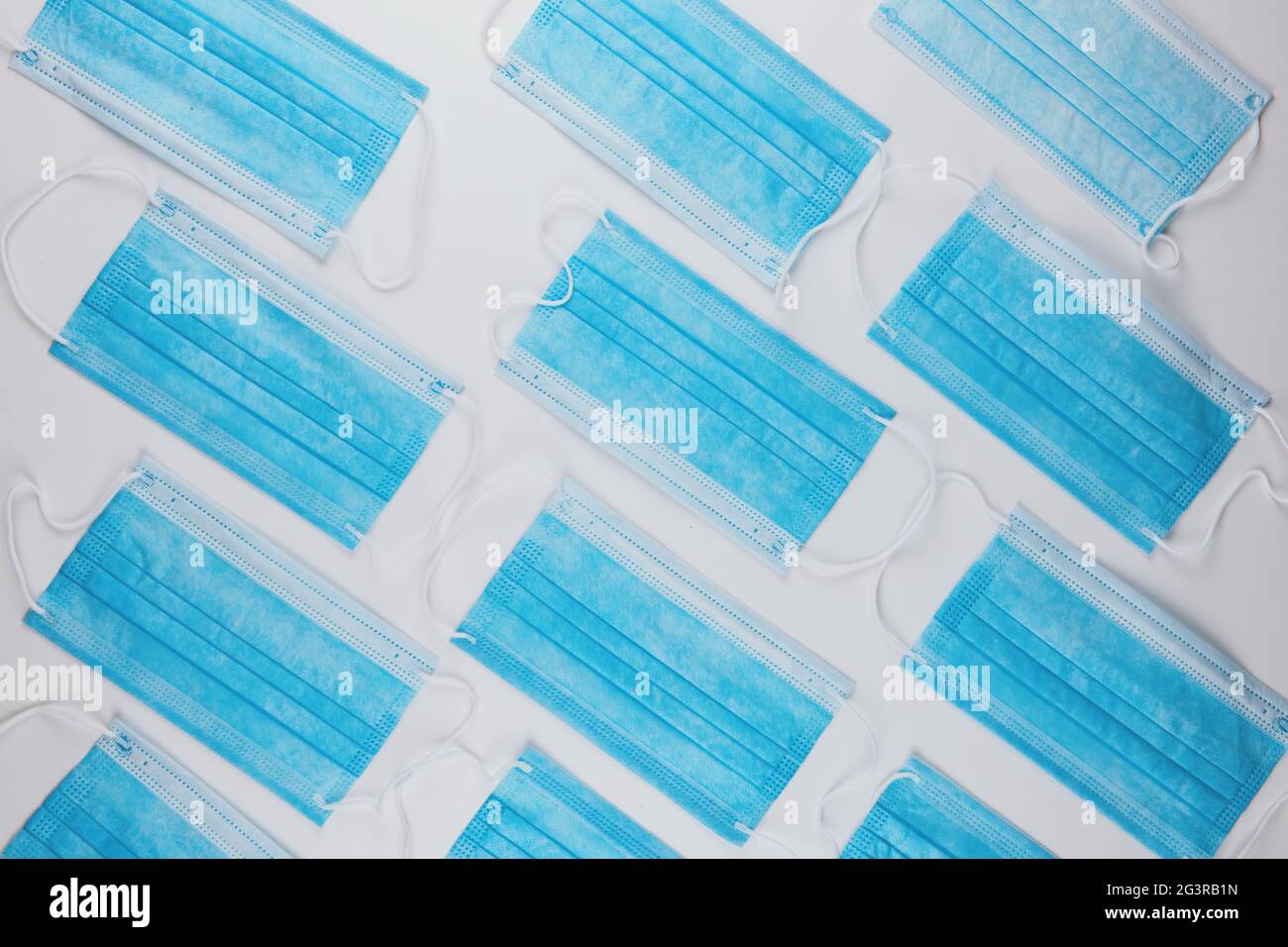 Medical masks on the blue colored background Stock Photo - Alamy