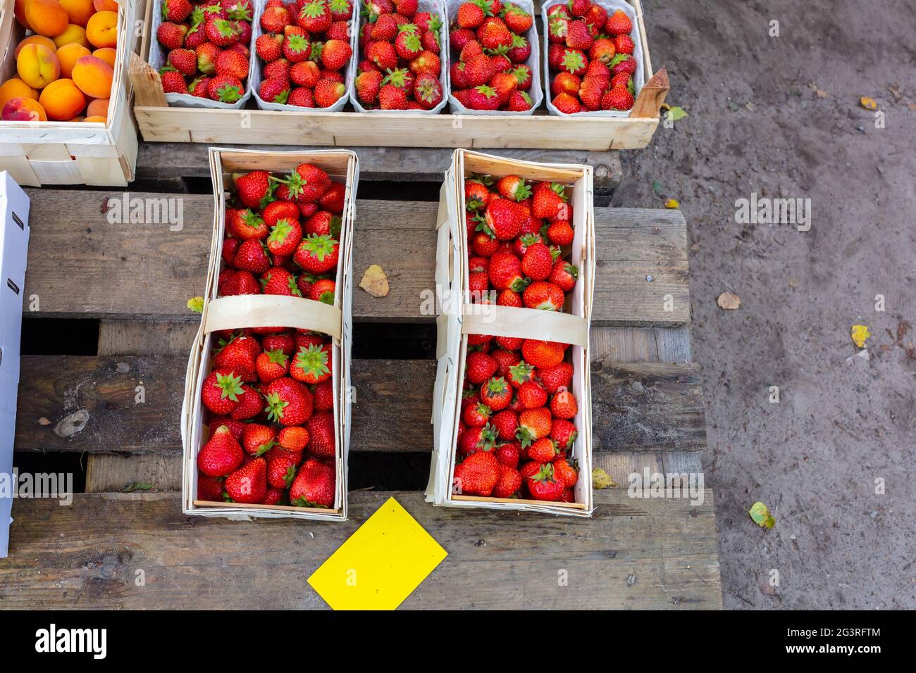 Strawberries in basket, market, fresh goods, freshly picked, sale from pallet Stock Photo