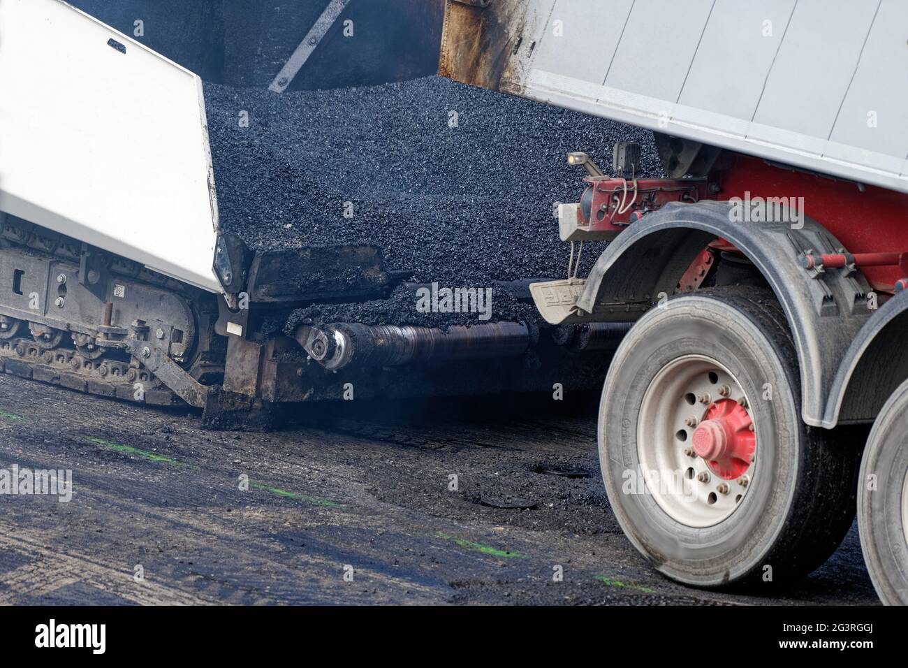 Loading asphalt pavers Stock Photo