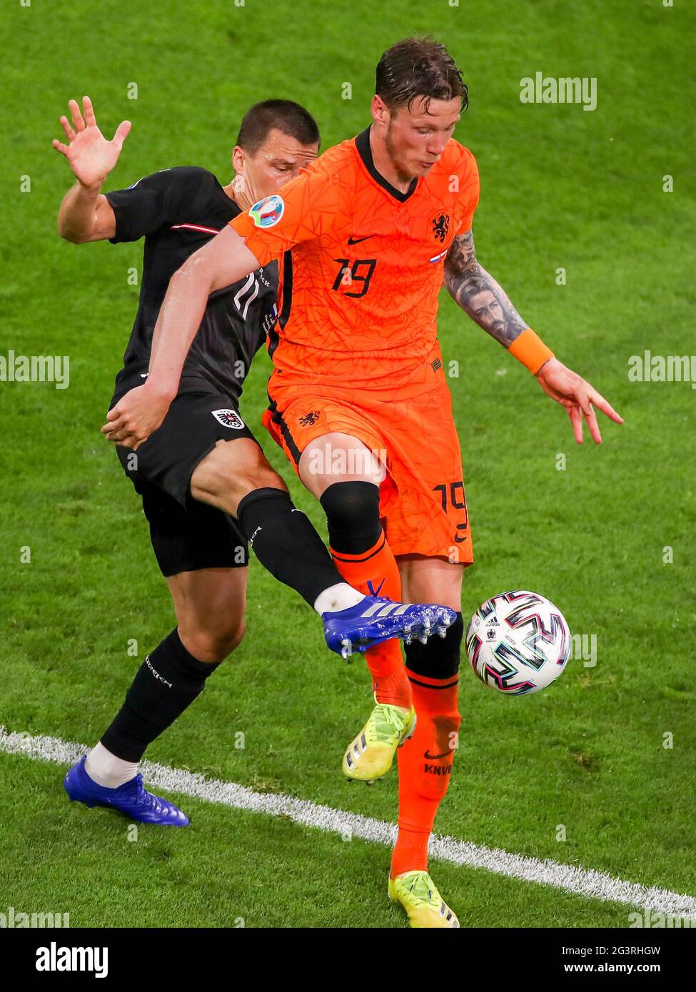 AMSTERDAM, NETHERLANDS - JUNE 17: Stefan Lainer of Austria, Wout Weghorst of the Netherlands during the UEFA Euro 2020 Championship Group C match between Netherlands National Team and Austria National Team at the Johan Cruijff ArenA on June 17, 2021 in Amsterdam, Netherlands (Photo by Marcel ter Bals/Orange Pictures) Credit: Orange Pics BV/Alamy Live News Stock Photo