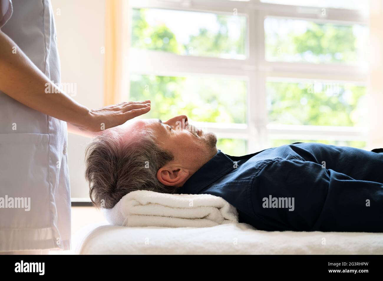 Reiki Therapy Alternative Healing Massage For Man Stock Photo Alamy