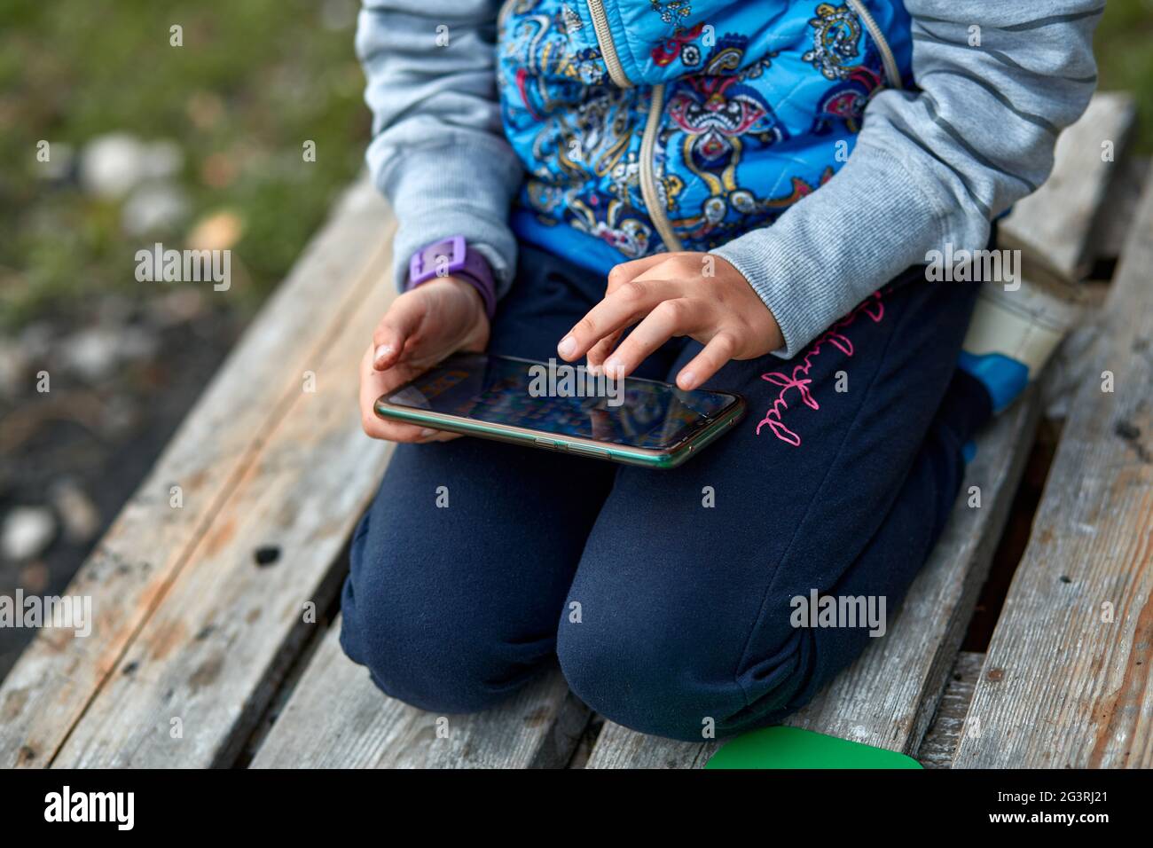 Kyiv, Ukraine - May, 15: Little girl play app on her mobile phone outside.  Modern game for children concept. Copy space. High quality photo Stock  Photo - Alamy