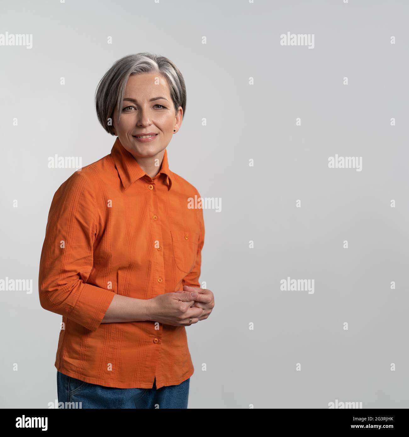 Mature woman wearing white shirt hi-res stock photography and images ...