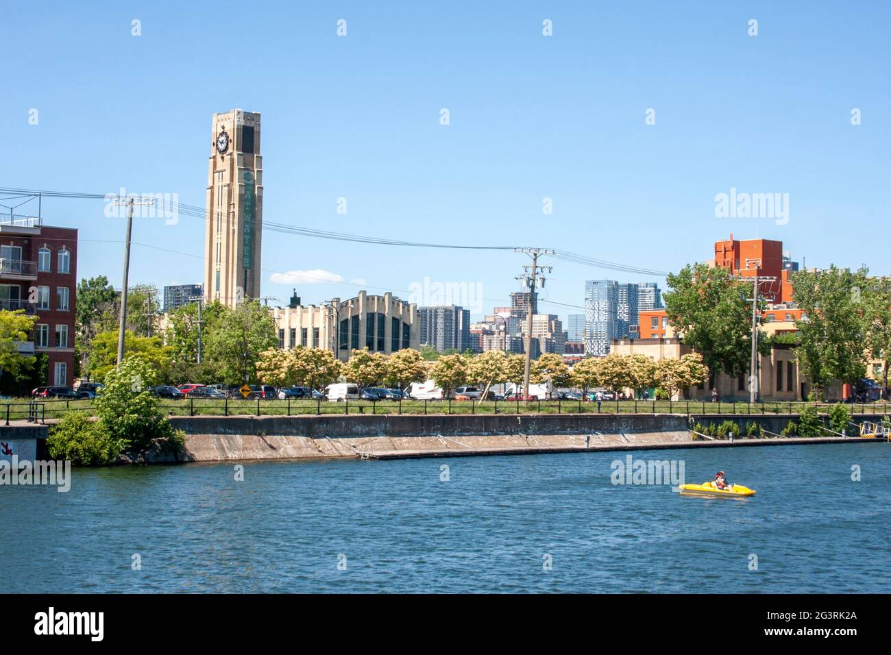 A pedalo in the Lachine Canal in front of Montreal's Atwater Market Stock Photo