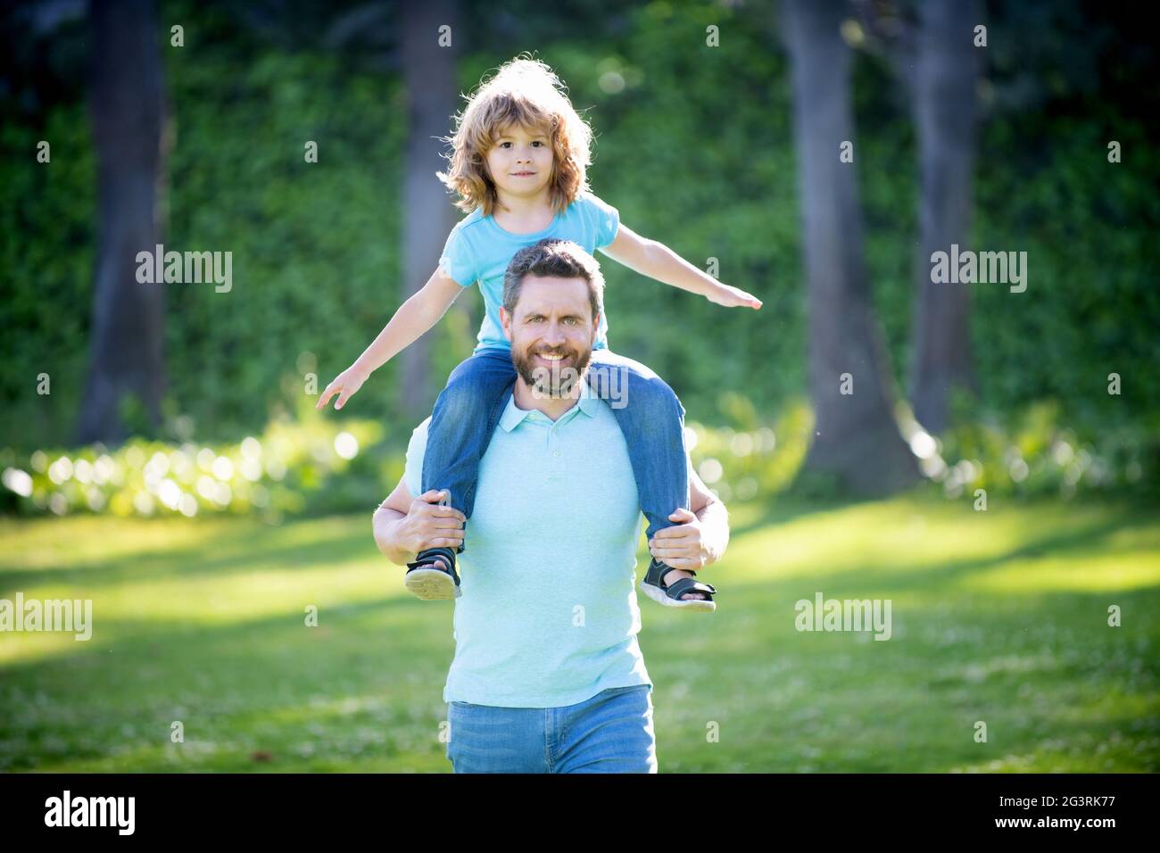 father hold his son outdoor. happy fathers day. happy family. dad and kid boy spend time together Stock Photo