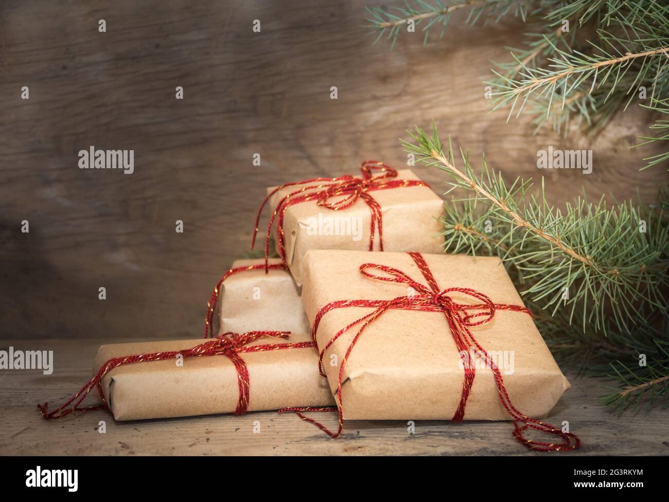 Group of Christmas gifts on rustic wood Stock Photo