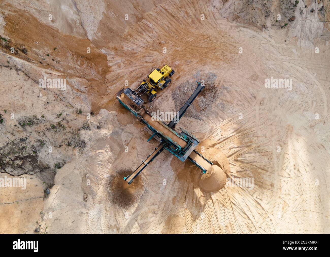 Arial view of the sand open-pit mining with heavy mining machinery ...