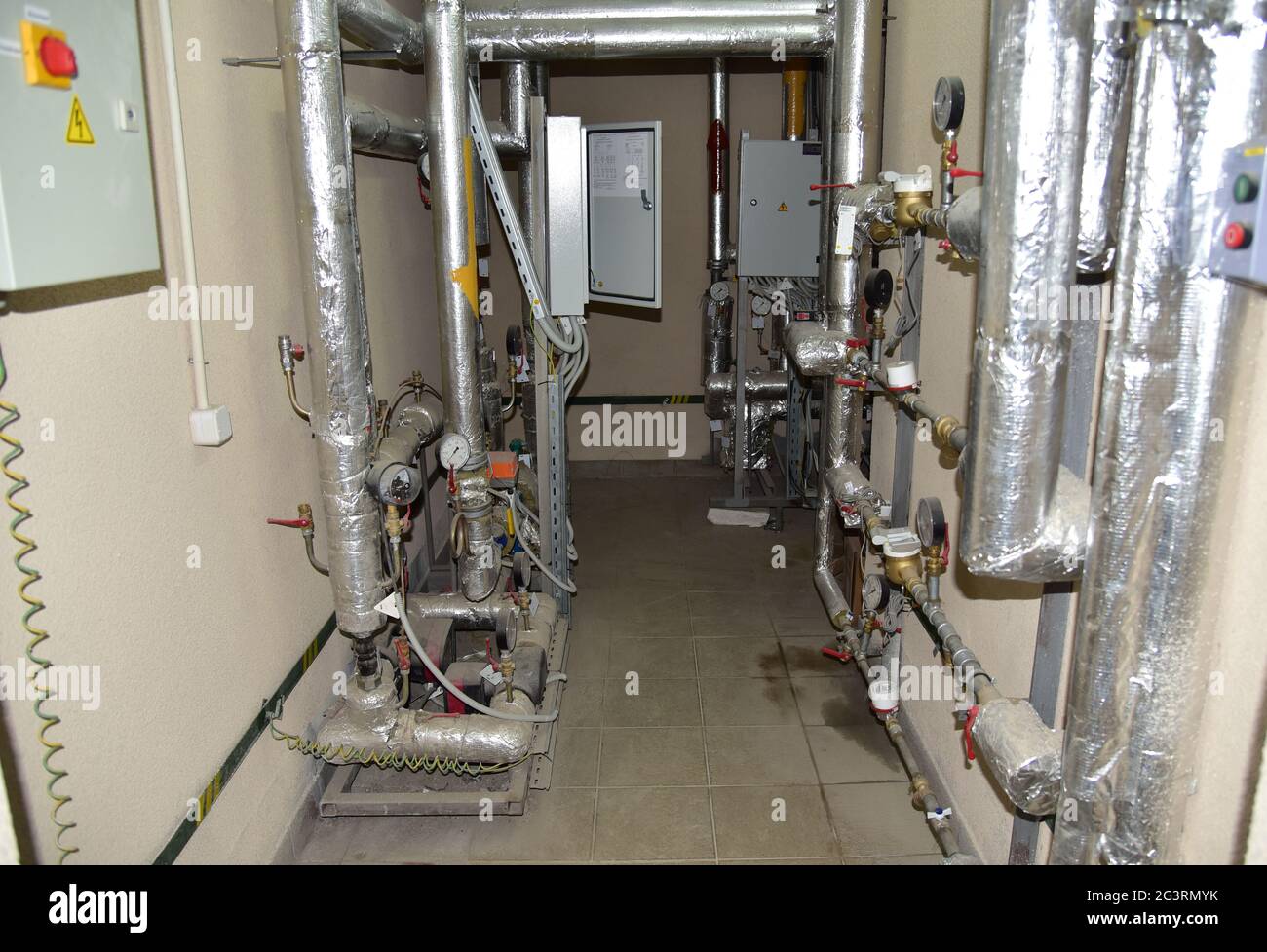 Heating system in boiler room at home. Round mechanical pressure gauge