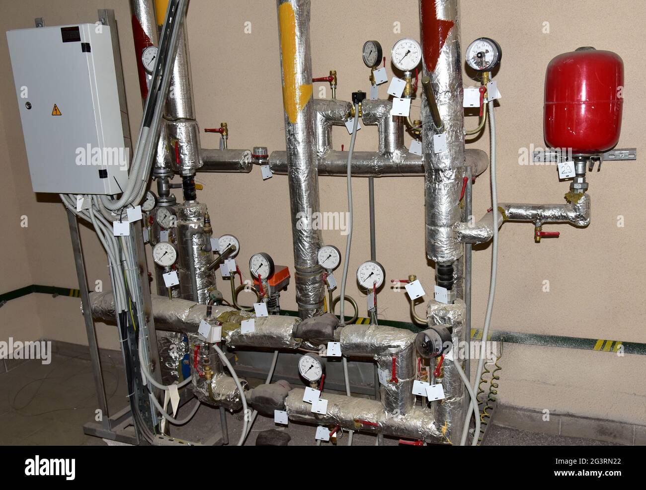 Heating system in boiler room at home. Round mechanical pressure gauge