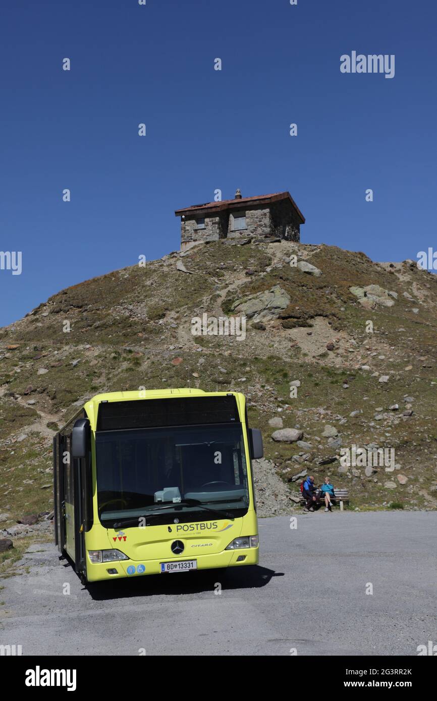 Italian Postbus parked on the Austrian side at Timmelsjoch, SÃ¶lden, Tyrol, Austria Stock Photo