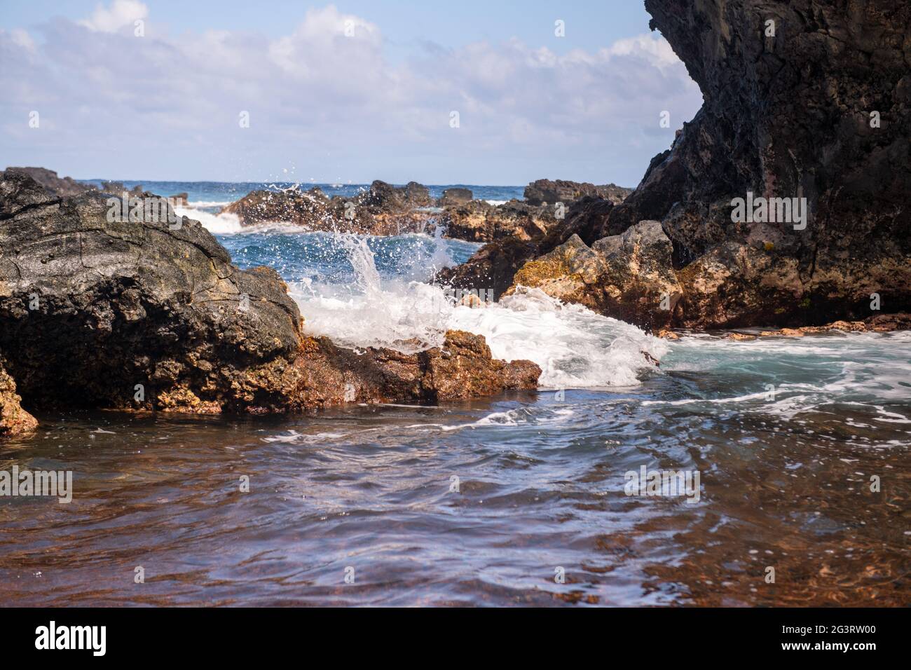 Sea waves and rock on the beach. Stock Photo