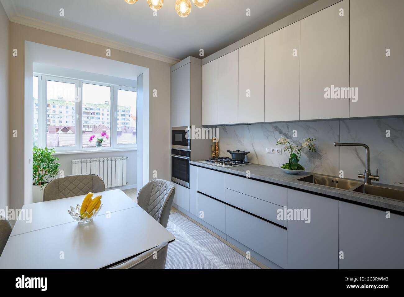 Modern gray and white kitchen interior Stock Photo Alamy