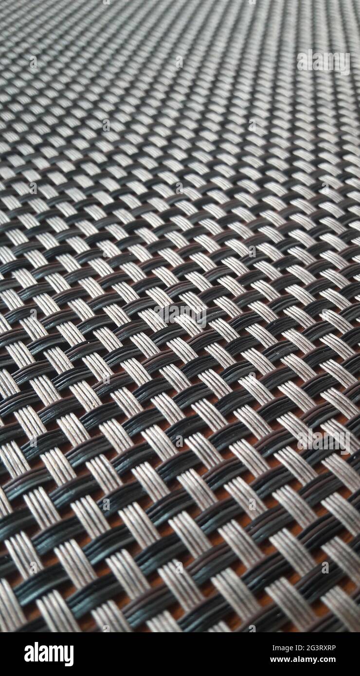 Interwoven black and brown metals pattern Stock Photo