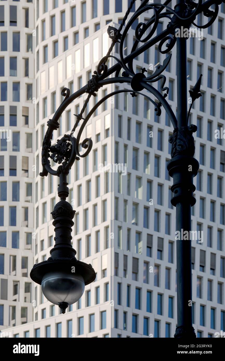 old Berlin gas lantern in front of the modern hotel complex One Berlin-Upper West, Germany, Berlin Stock Photo