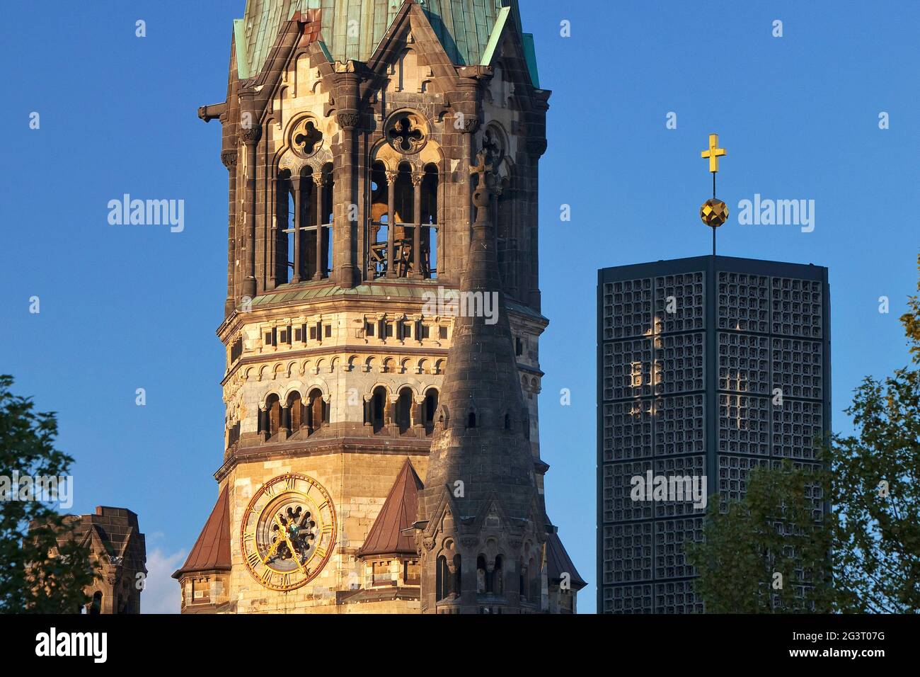 Kaiser Wilhelm Memorial Church, partial view with old steeple ruin and new steeple, Germany, Berlin Stock Photo