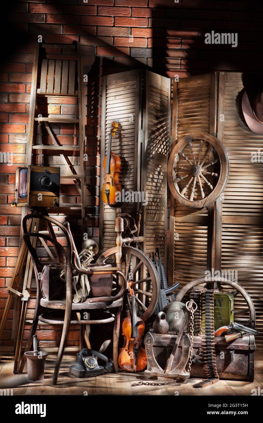 Still Life With Old Spinning Wheel, Violins And Ladder Stock Photo Alamy