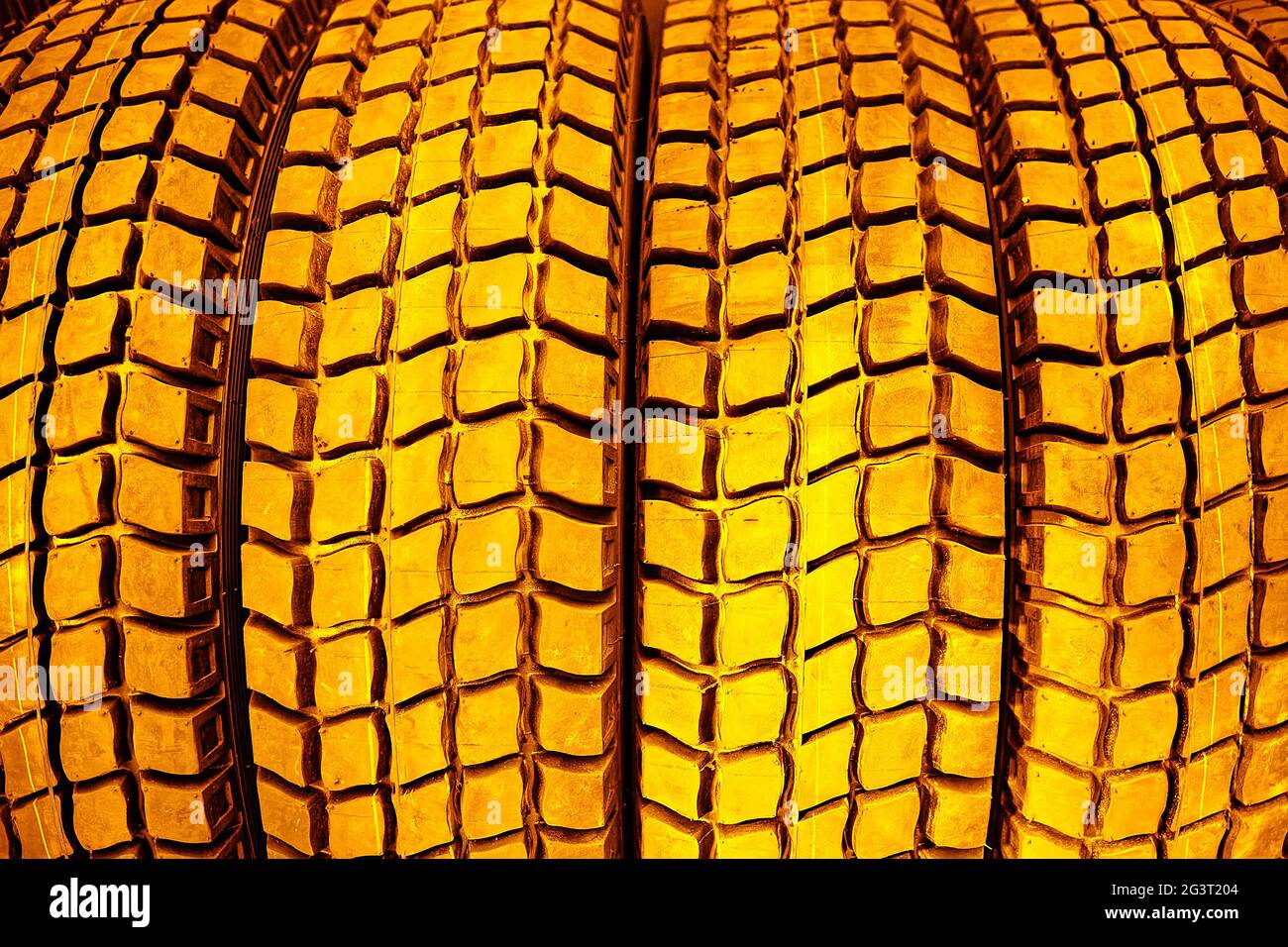 Gold tire tread close-up.The concept of expensive car maintenance. Stock Photo