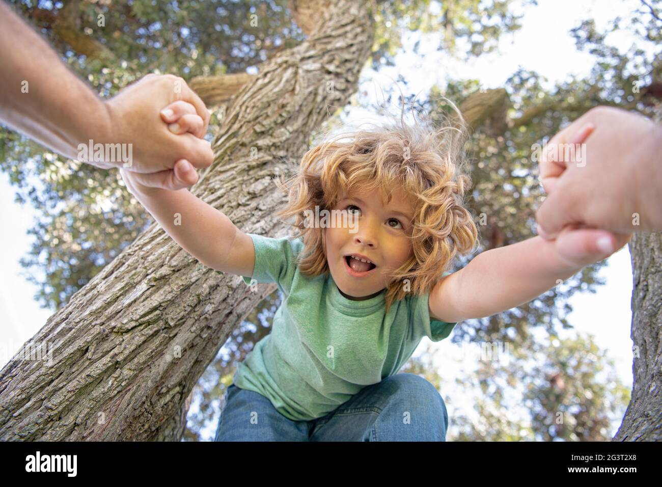 Fathers hand. Father helping son. Parent holds the hand of child. Stock Photo