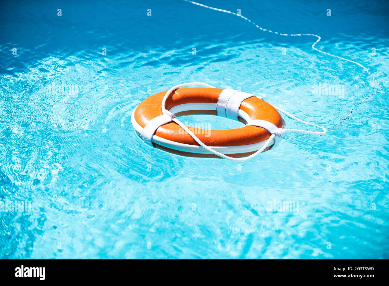 Lifebuoy in swimming pool. Summer vacation concept. Life buoy in water