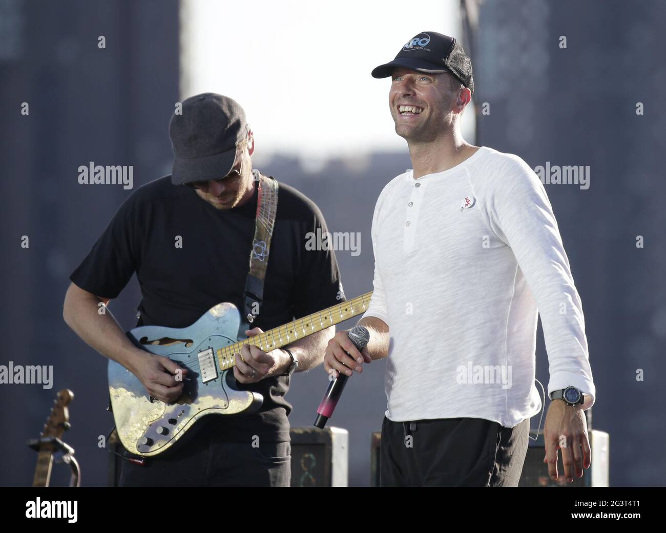 Coldplay band members performing live in 2021