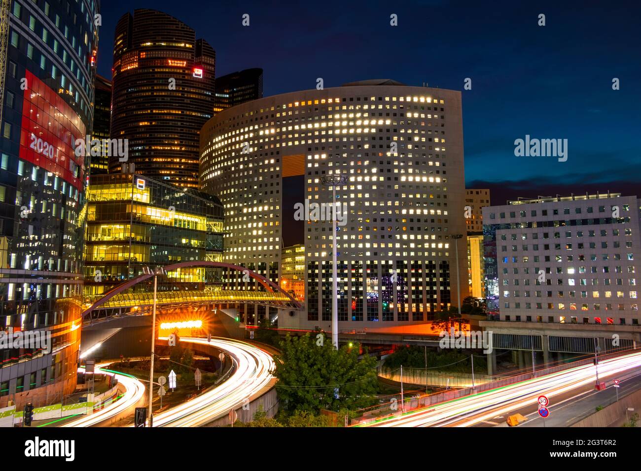 Modern Buildings and Evening Traffic Stock Photo