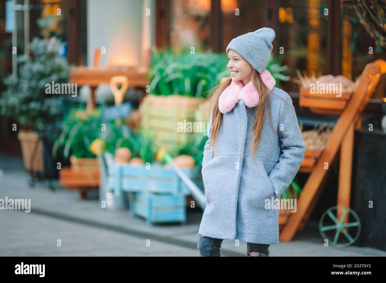 Adorable happy little girl outdoors in european city Stock Photo - Alamy
