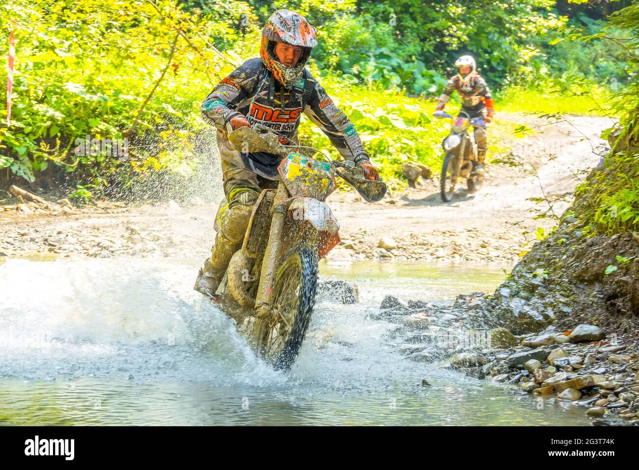 Two Athlete Enduro Crossing a Small River Stock Photo Alamy