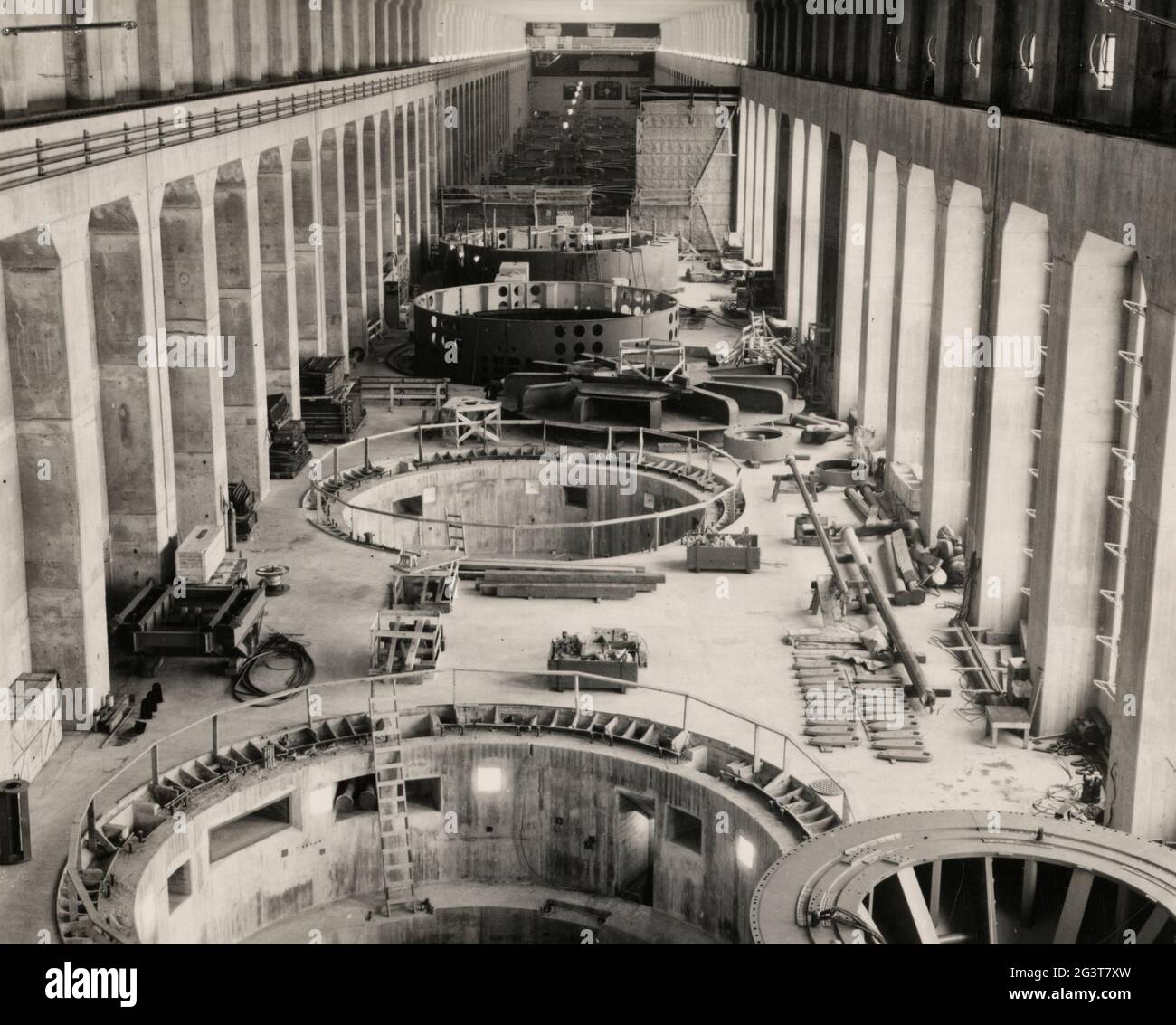 Interior view of the powerhouse at the Bonneville Dam on the Columbia River between Multnomah County, Oregon and Skamania County, Washington, showing construction, circa 1935 Stock Photo