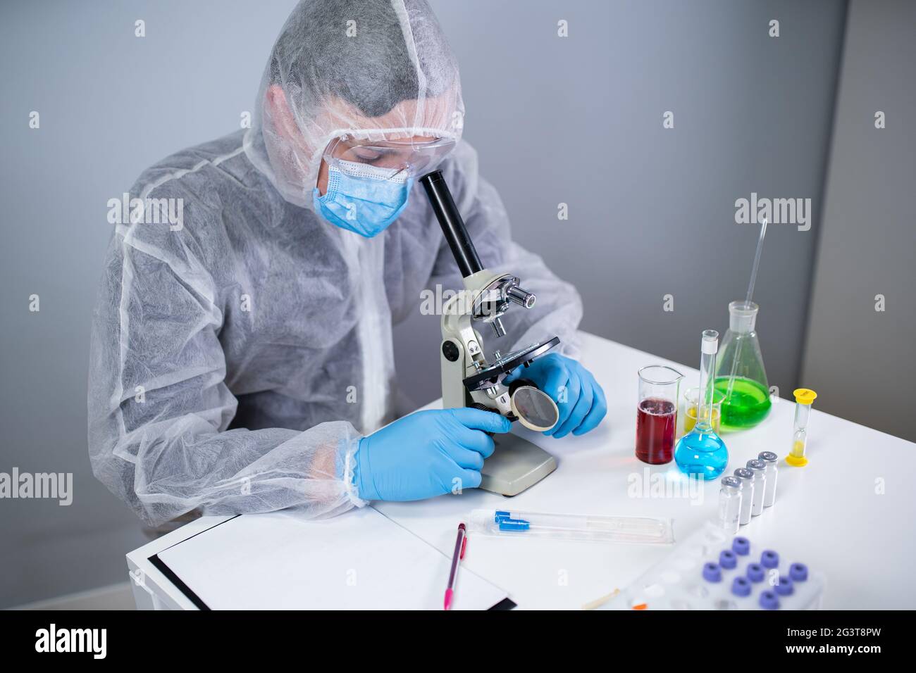 Pharmaceutical manufacturers develop viral medicines by inventing best ingredient. Scientist wearing personal protective equipme Stock Photo