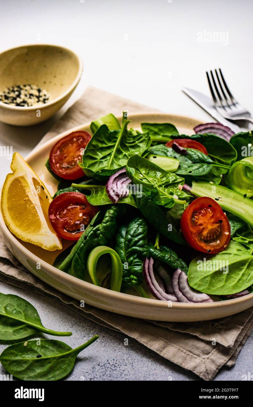 Spinach salad with sesame seeds Stock Photo - Alamy