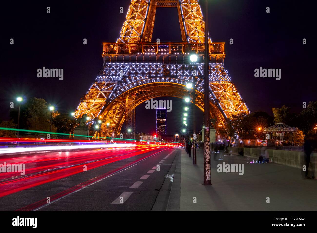 Eiffel Tower and Many Lights of Night Traffic Stock Photo