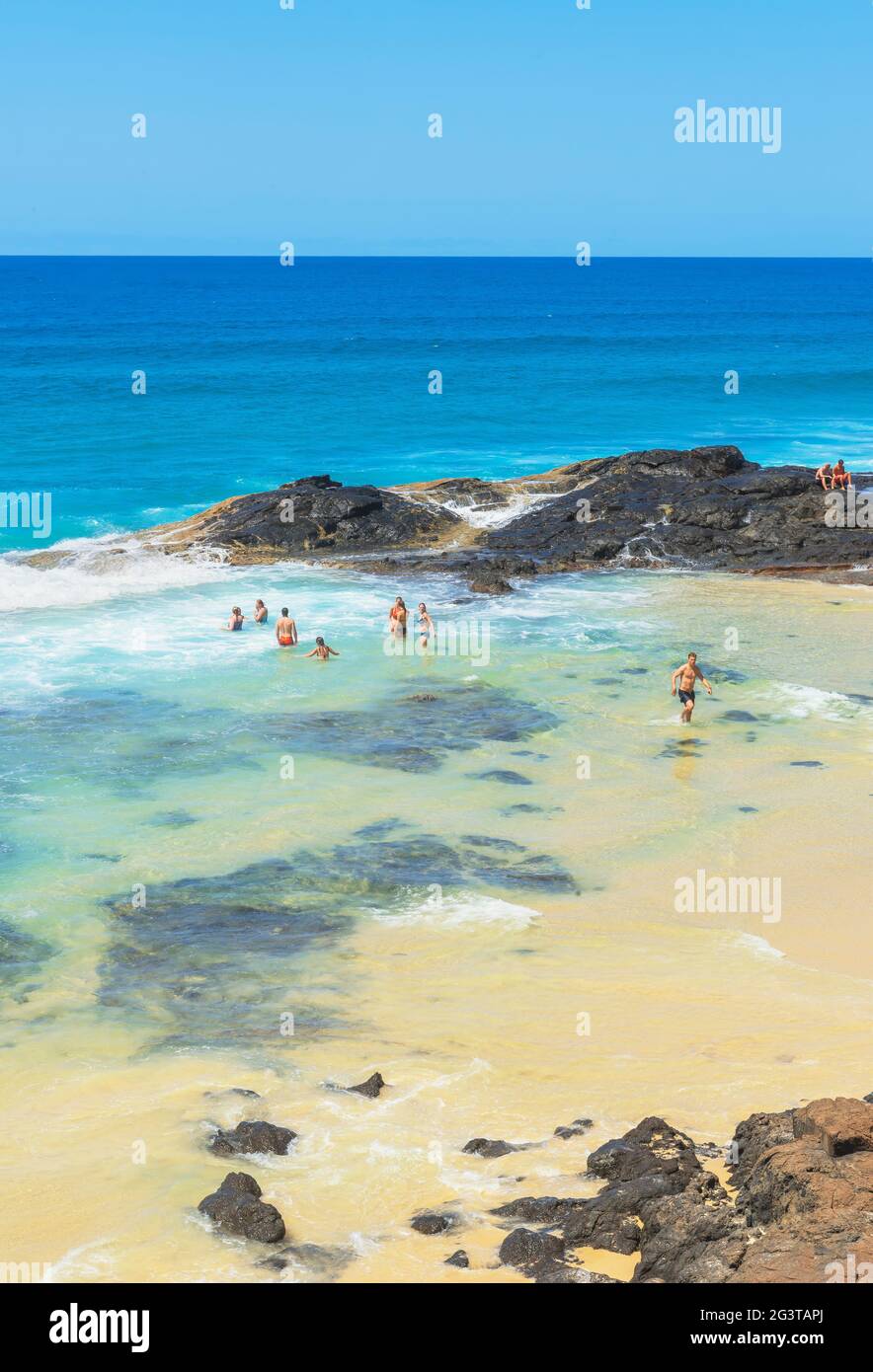 People swimming in Champagne pools, Great Sandy National Park, Fraser Island, Queensland, Australia, Stock Photo