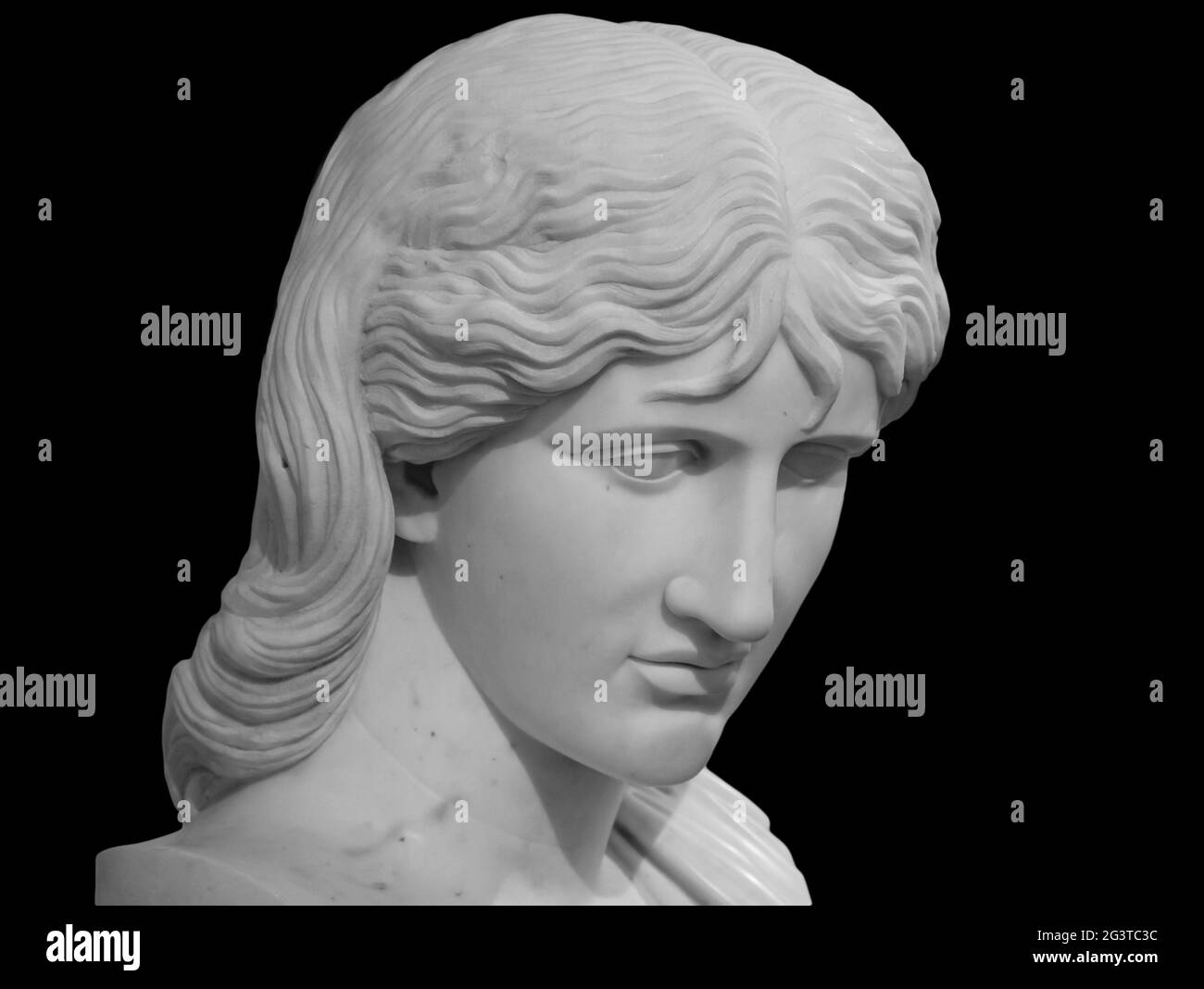 Ancient statue head isolated on black background. Barbarian woman known