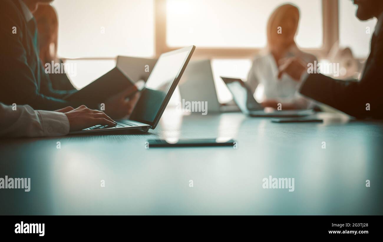 Link build developers testing usability of a new program or website with different operation system laptops in the modern office Stock Photo