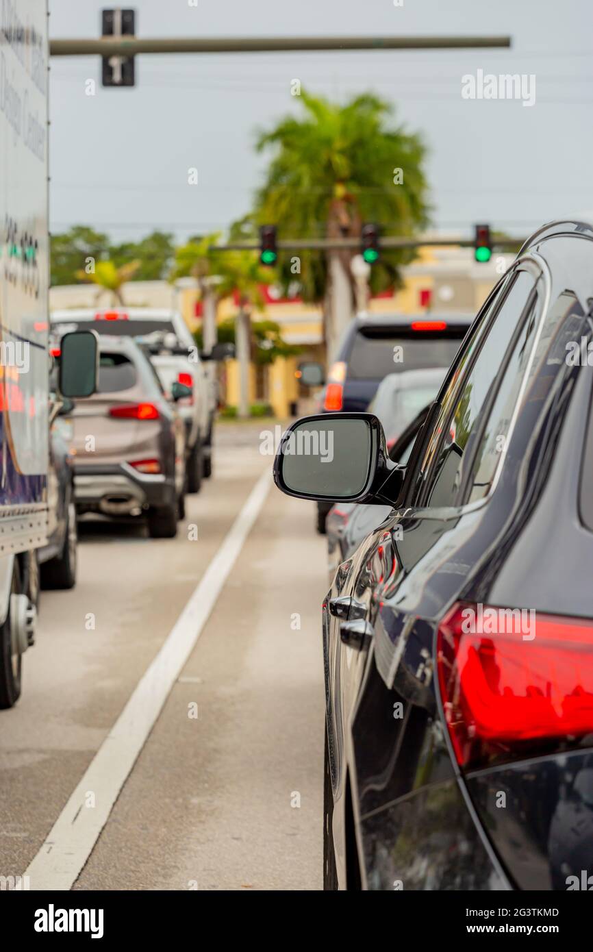 Electric car connected to a charging station in Naples, Florida Stock
