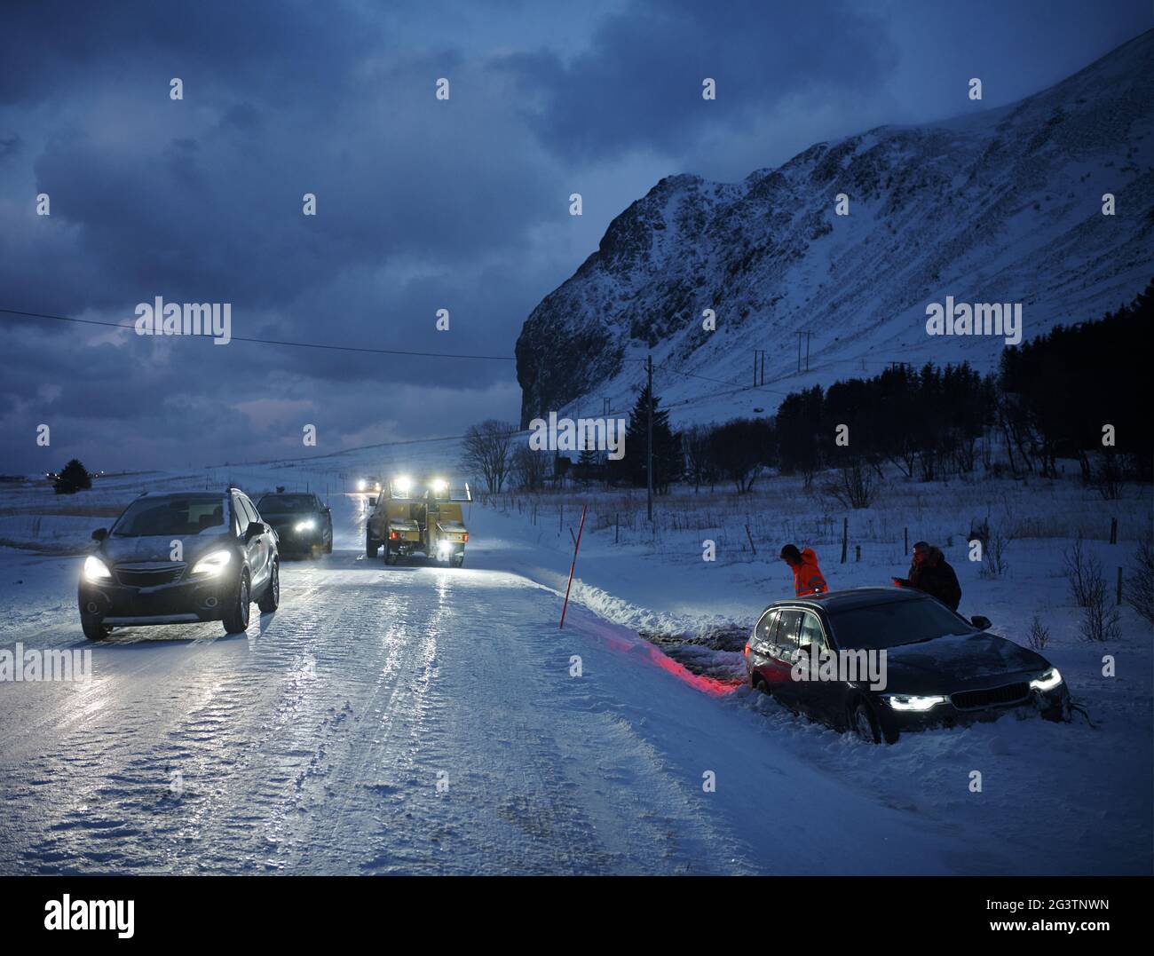 Car being towed after accident in snow storm Stock Photo Alamy