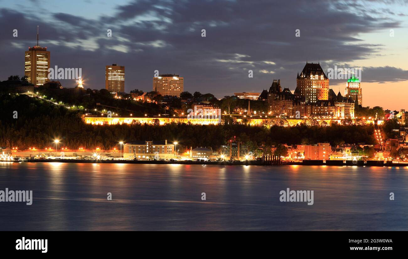 Quebec City skyline at dusk with Saint Lawrence River on the foreground Stock Photo